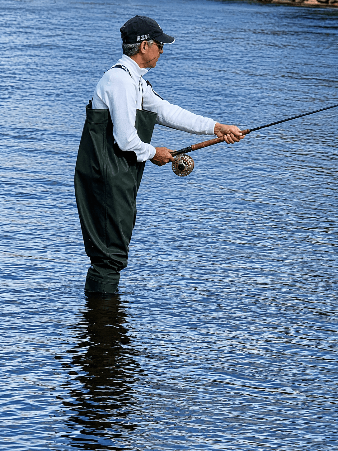 Sherif Gabr fly fishing in river representing reflection and disciplined presence